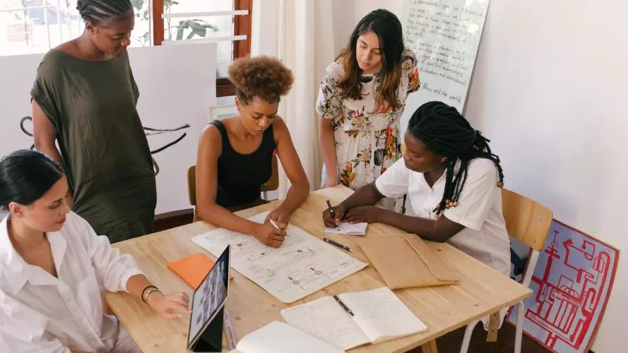 Photos of women in a meeting